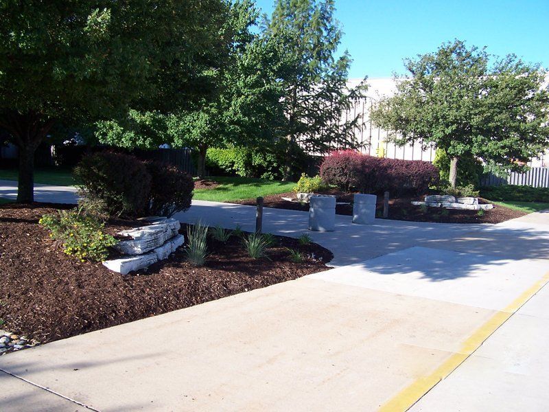 Newly Applied Mulch In The Lawn — Coal Valley, IL — Kymbyl Komplete Kare , INC.