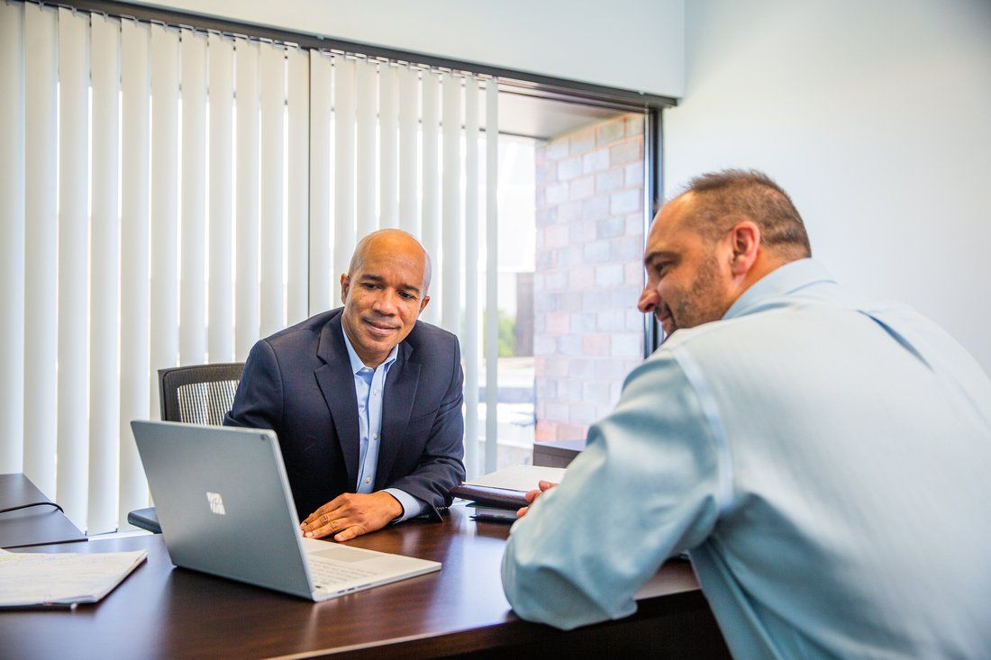 Robert Miller with a client at RS Miller & Associates