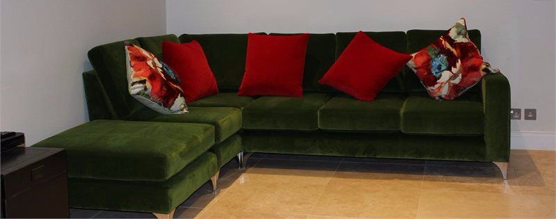 corner suit upholstered in dark green velour
