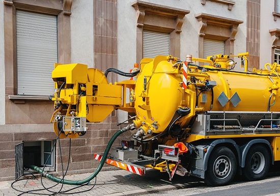 Sewerage truck on street working in Corbin
