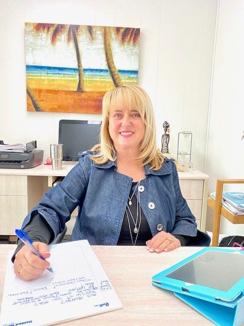 woman signing paper