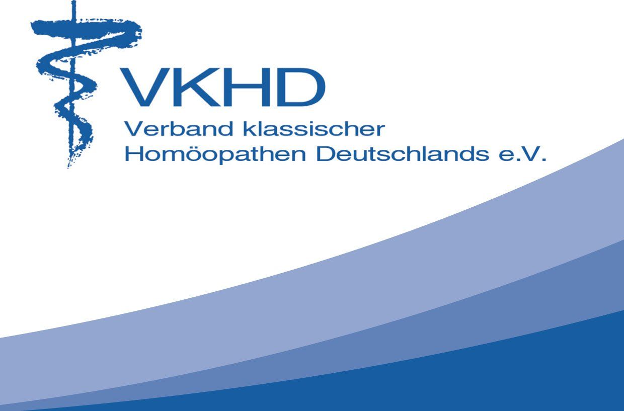 A blue and white logo for vkhd verband klassischer homöopathien deutschlands e.v.