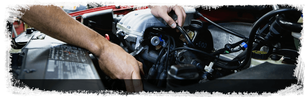 Mechanic working on a car engine