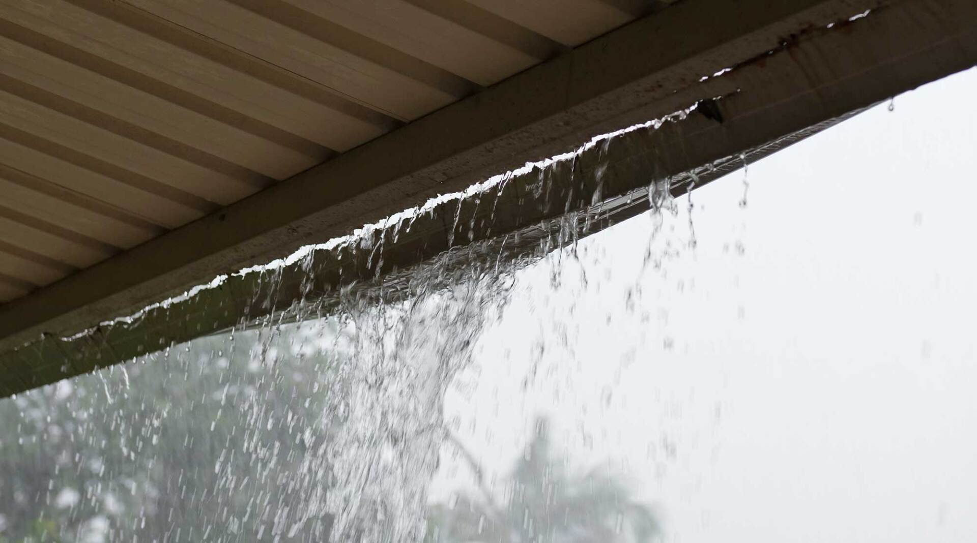 Broken Gutter with Rain Pouring — Charleston, SC — Palmetto Outdoor Restoration