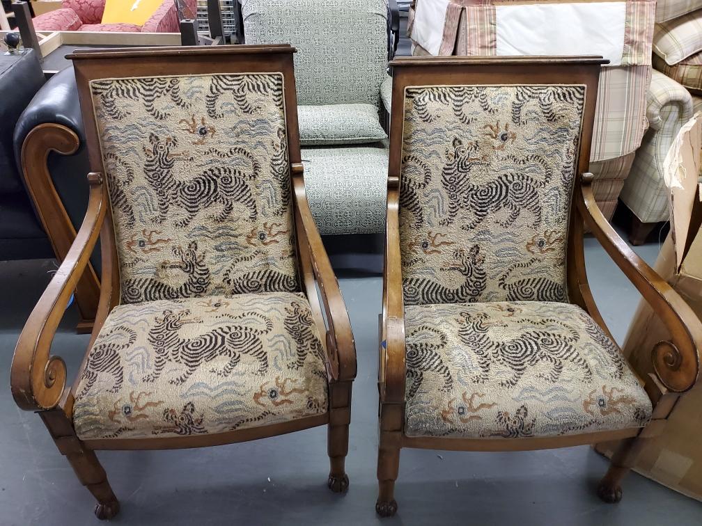 A pair of chairs with a zebra print on them
