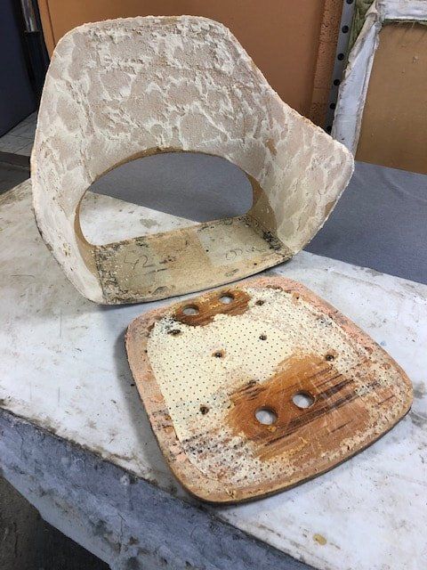 A piece of wood is sitting on top of a piece of foam