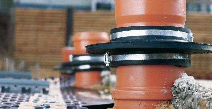 A bunch of pipes are sitting on top of each other on a table.