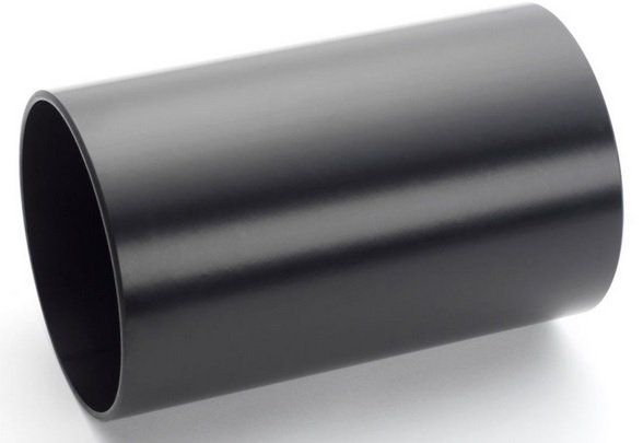 A black plastic pipe is sitting on a white surface