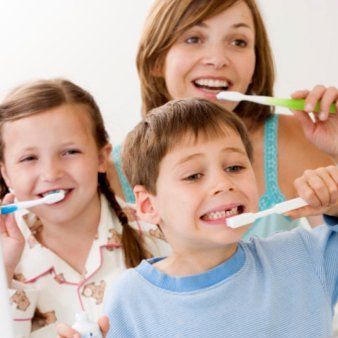 Mother and children brushing their teeth in Silver Spring, MD