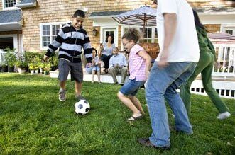Family playing soccer Family playing soccer
