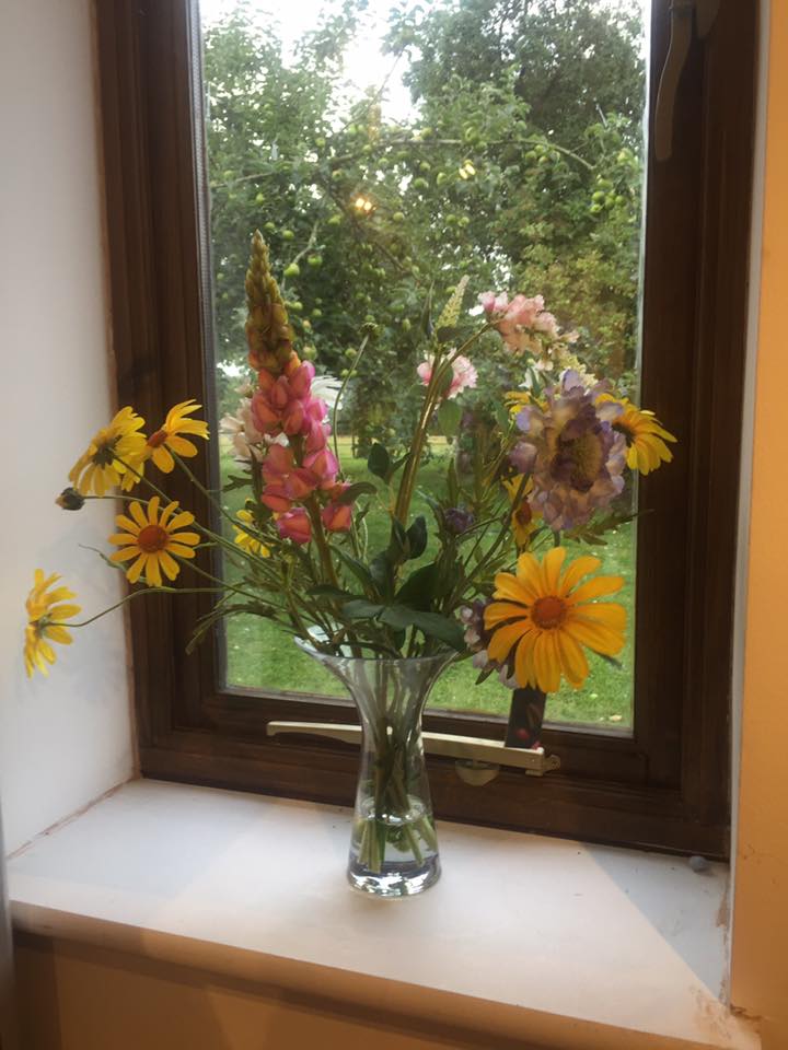 vase of flowers in window