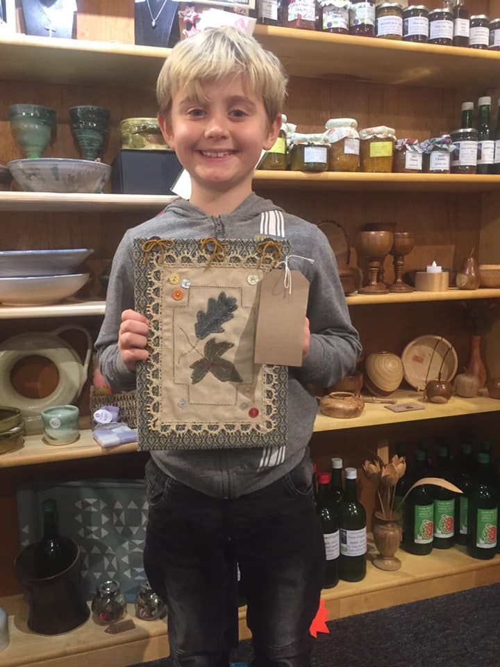 child holding embroidered book