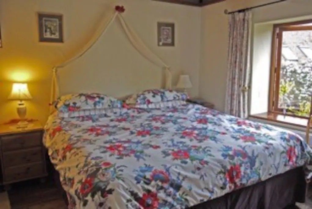 Bed in bedroom at accommodation