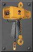 A yellow chain hoist is hanging on a gray wall.