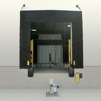 A warehouse loading dock with a black cover on it.