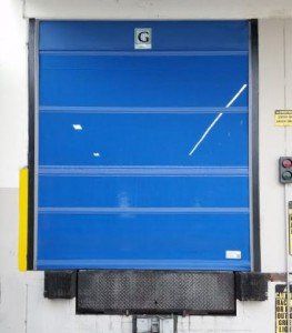 A blue door with the letter g on it