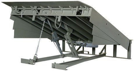 A gray metal ramp with a chain attached to it on a white background.