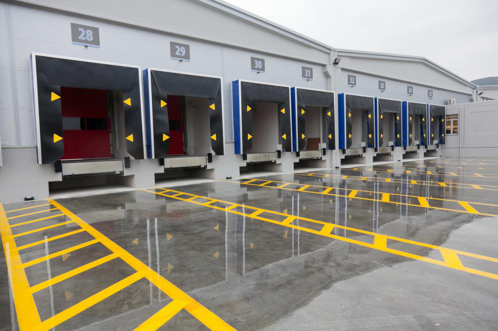 A row of loading docks in a warehouse with the number 28 on the side