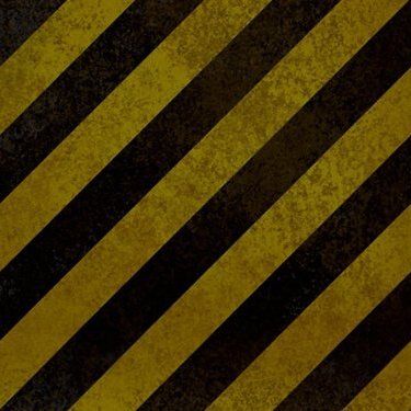 A close up of a yellow and black striped background.
