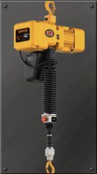 A yellow chain hoist with a hook attached to it.
