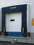 A warehouse with a loading dock and a loading door.
