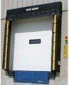 A white dock door with a blue ramp attached to it.