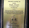 A picture of a plaque that says `` image awards & engraving ''.
