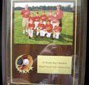 A picture of a baseball team in a frame.