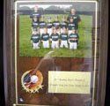 A plaque with a picture of a baseball team on it.
