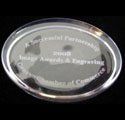 A clear glass plaque with the words `` image awards & engraving '' engraved on it.