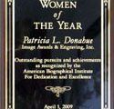 A plaque that says `` women of the year '' on it.