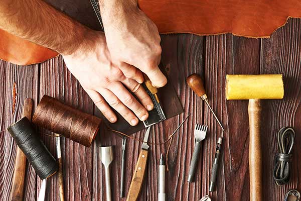 Man Working with Leather - Shoe Repair in Philadelphia, PA