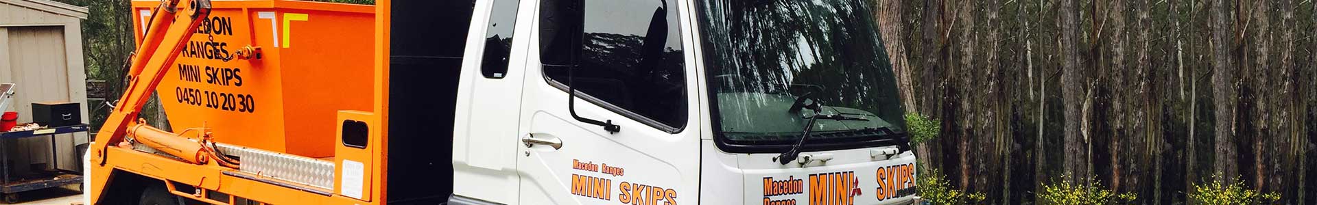 Macedon Ranges Mini Skips trucks with orange skip bins ready for delivery