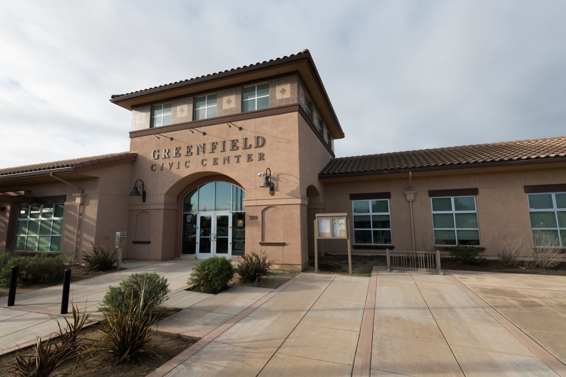 A large building with the word Greenfield Civic Center on it