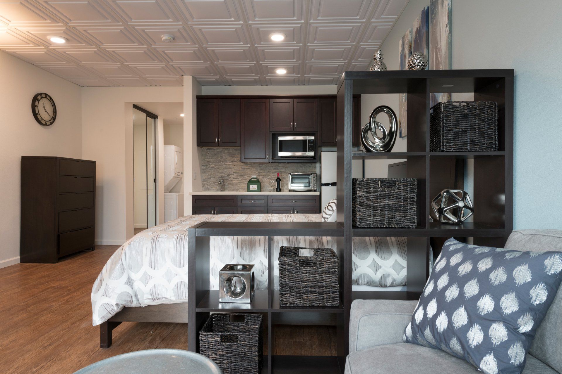 A living room with a couch and a bed in it