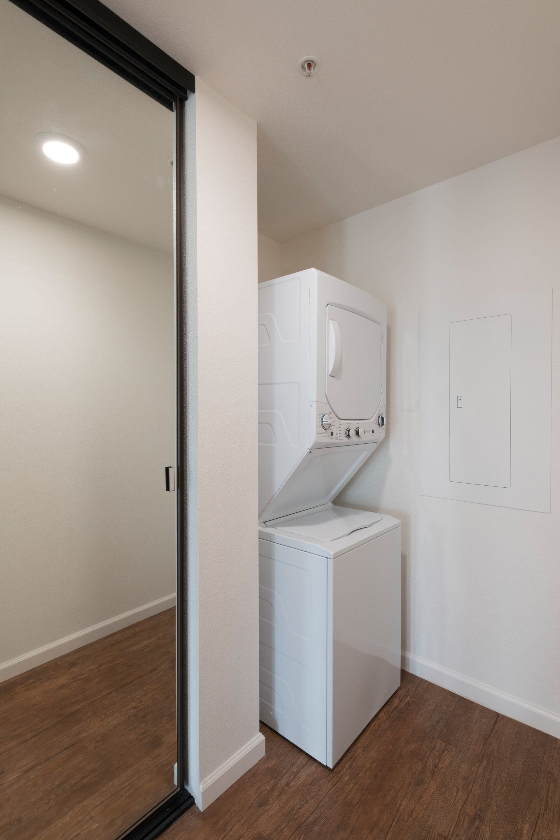 A laundry room with a washer and dryer in it