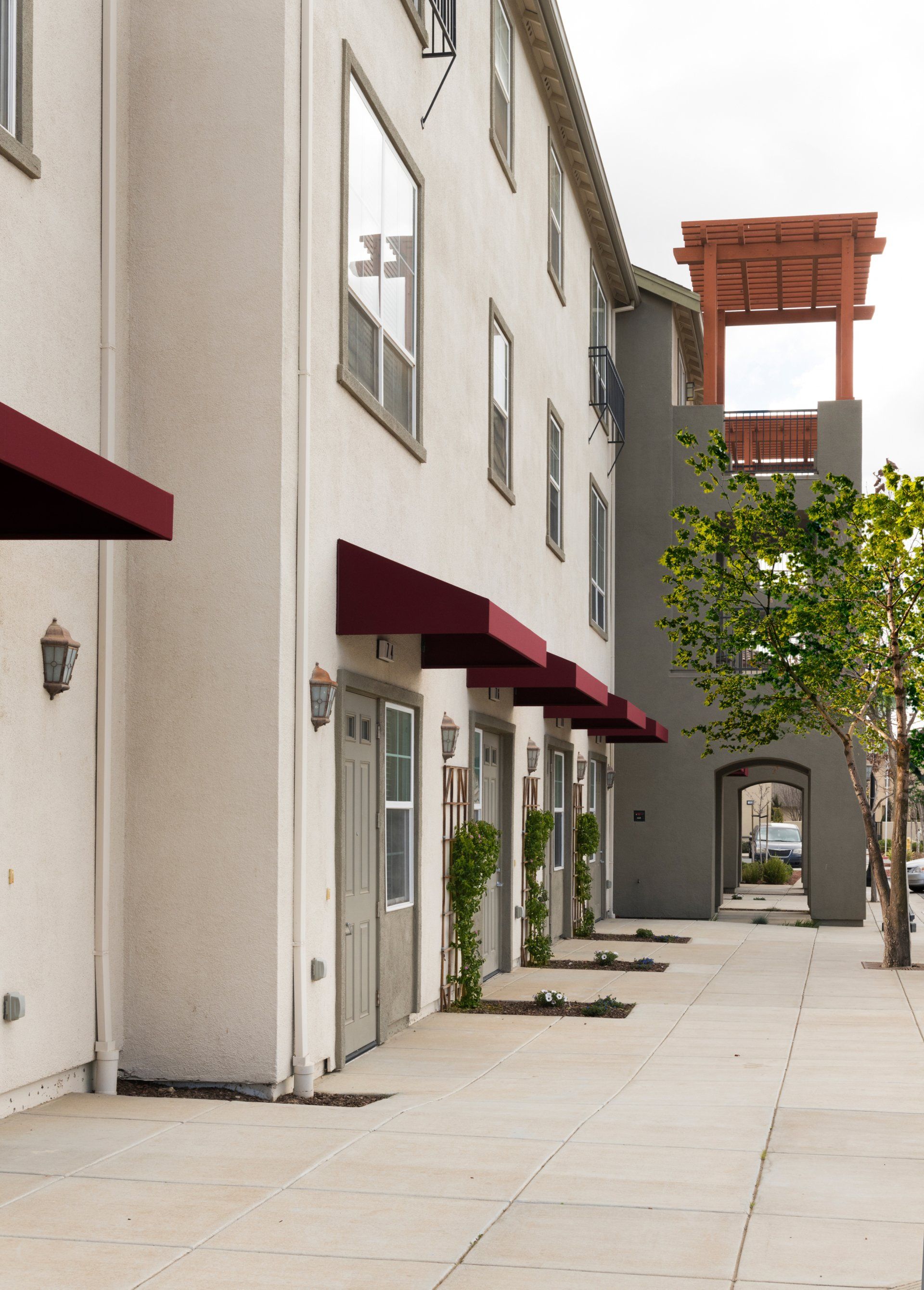 A building with red awnings on the side of it