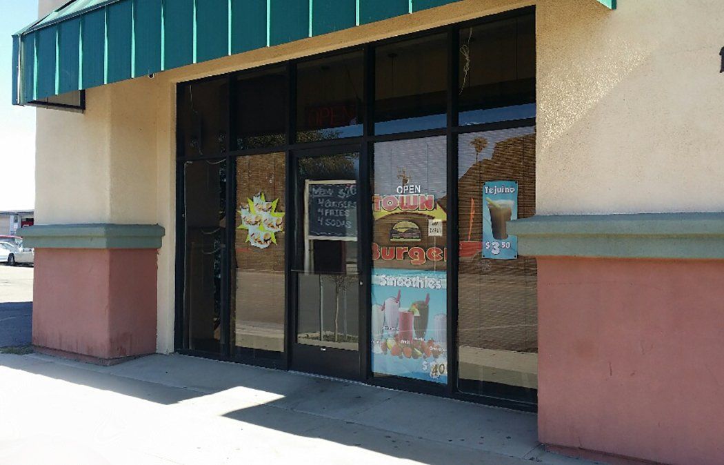 A store front with a green awning