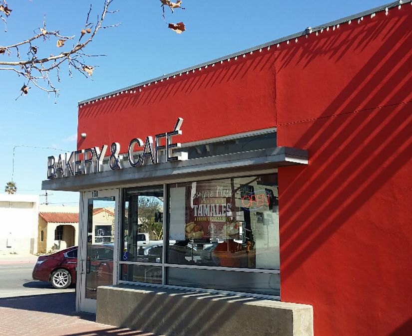 A red building with the words bakery and  cafe on it