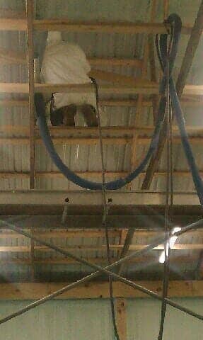 Man fixing insulation — Home Insulation in Whitehouse Station, NJ