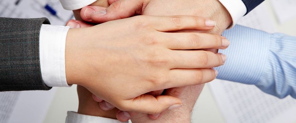 manage the relationship with your technology partners hands holding hands