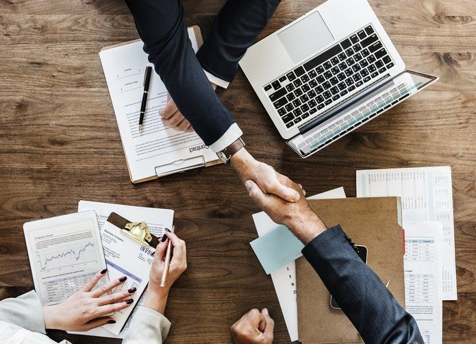 Business handshake in the office — Saint Cloud, MN — Moe Agency Inc