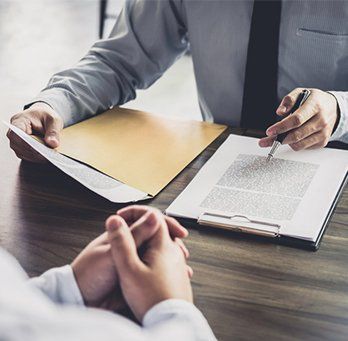 Consultation between a businessman and male lawyer — Saint Cloud, MN — Moe Agency Inc
