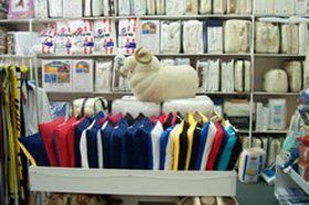 store room with selection of quilt covers and towels