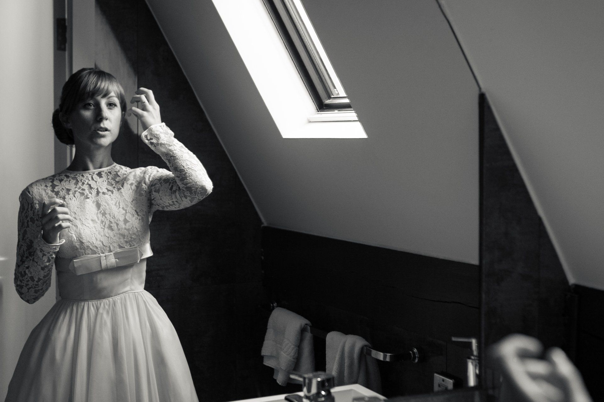 Manchester Bride fixing her hair in the mirror