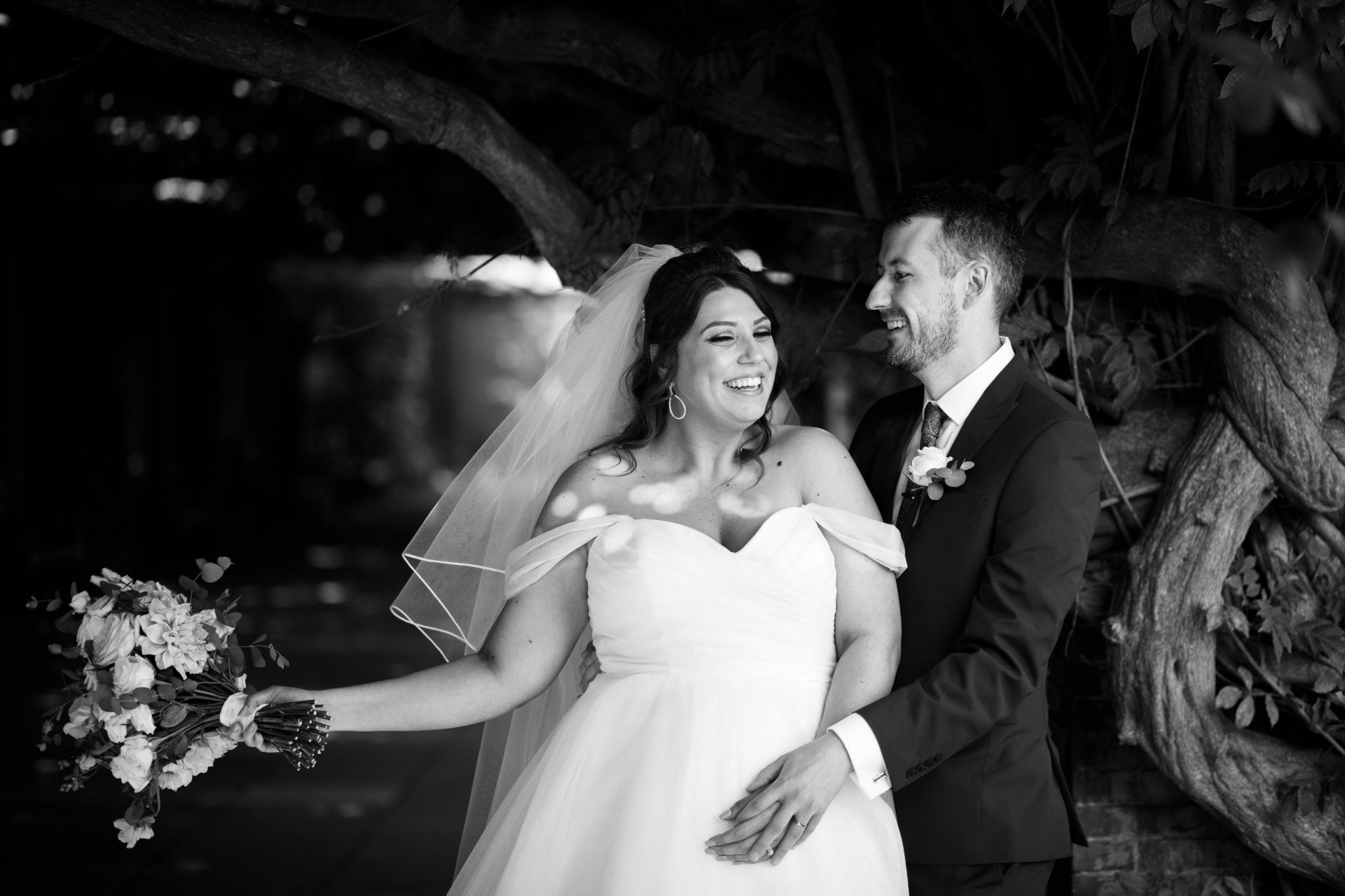 Harrogate wedding photos smiling bride holding grooms hand