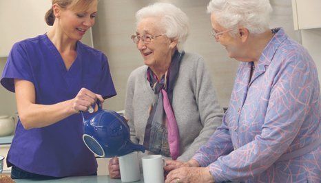 A carer providing tea