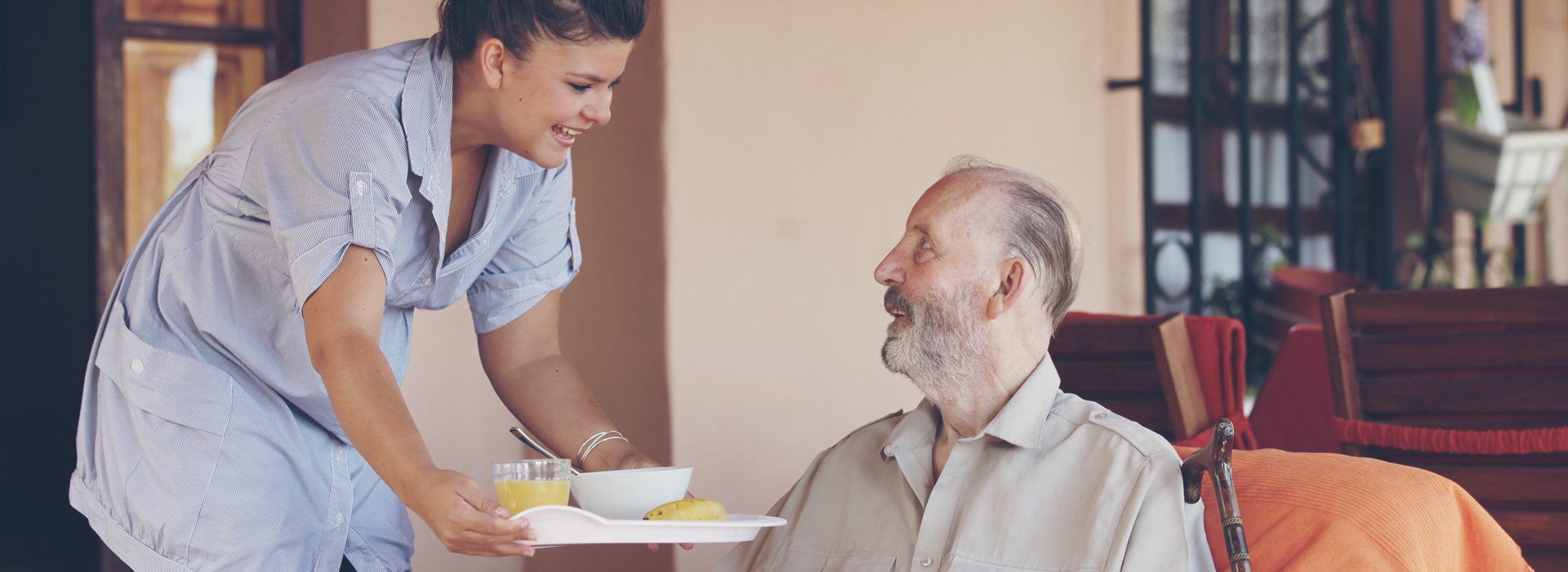 A carer serving food