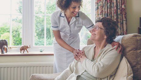 A carer comforting the elderly