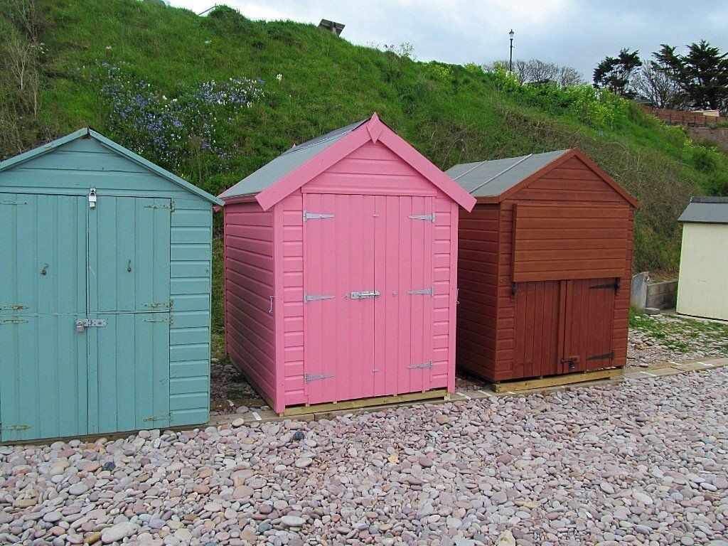 Bespoke beach hut in pink on beach in devon